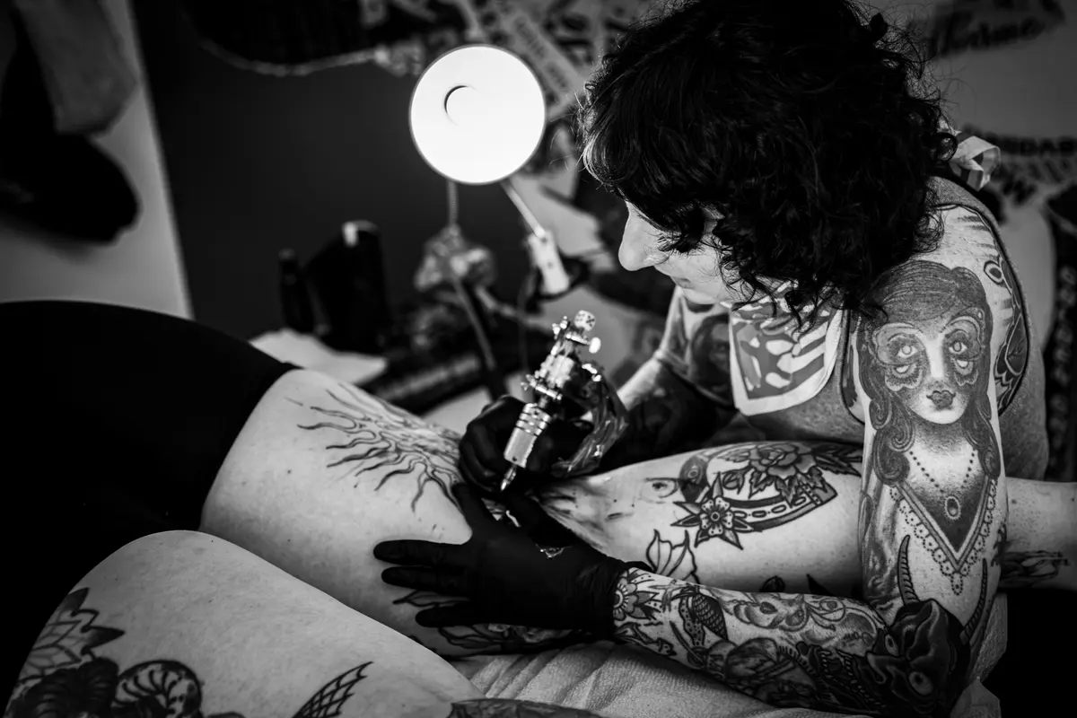 Tattoo artist working at VOID Tattoo Fest.