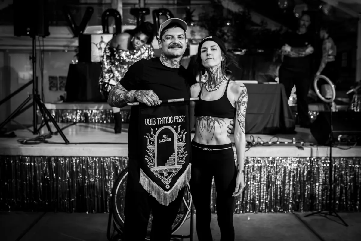 Best Blackwork tattoo contest winner on stage.